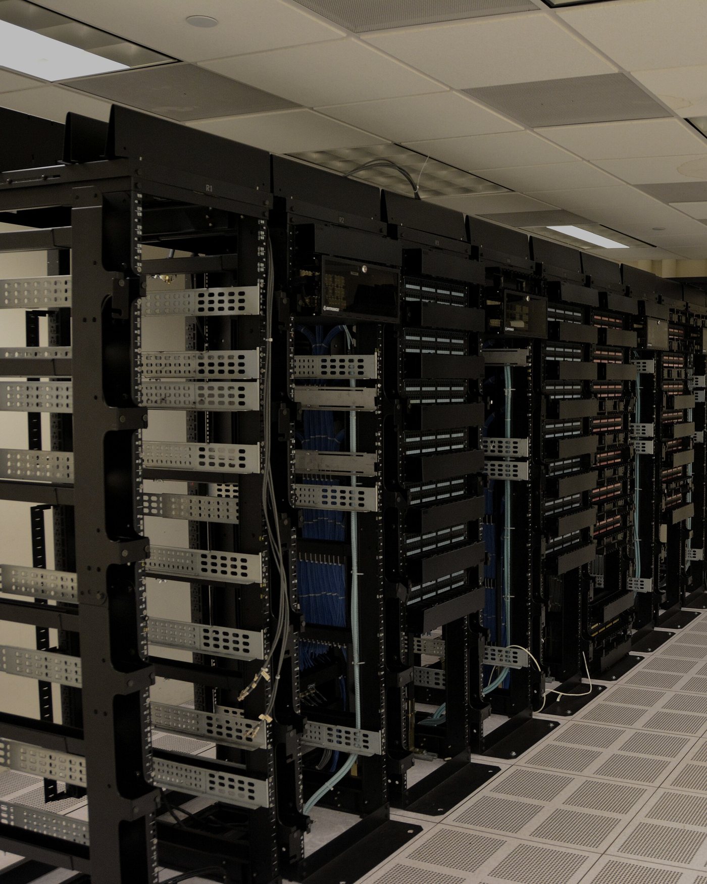 A row of server racks in a data center aisle.
